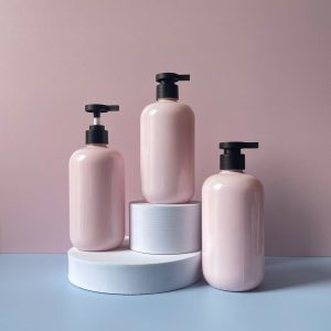 Chai PET hồng tròn vòi nhấn đen nhám