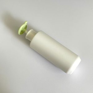 Chai HDPE trắng vai ngang vòi nhấn dẹp xanh