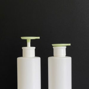 Chai HDPE trắng vai ngang vòi nhấn dẹp xanh