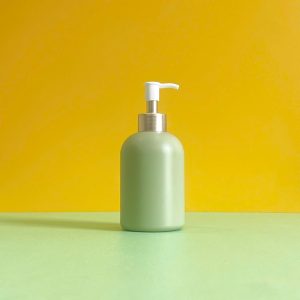 Chai HDPE xanh lá tròn lùn vòi nhấn kẹp trắng