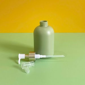 Chai HDPE xanh lá tròn lùn vòi nhấn kẹp trắng