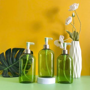 Chai đựng dầu gội PET xanh ngọc vòi nhấn kẹp xanh lá
