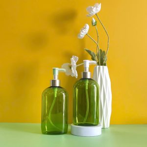 Chai đựng dầu gội PET xanh ngọc vòi nhấn kẹp trắng 500ml